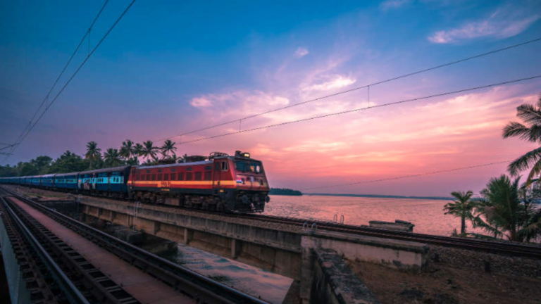 train passing through a bridge on river